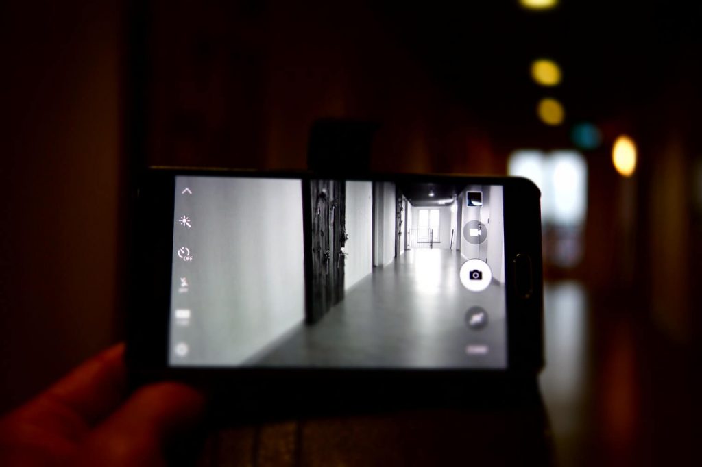 Person recording a video on a smartphone