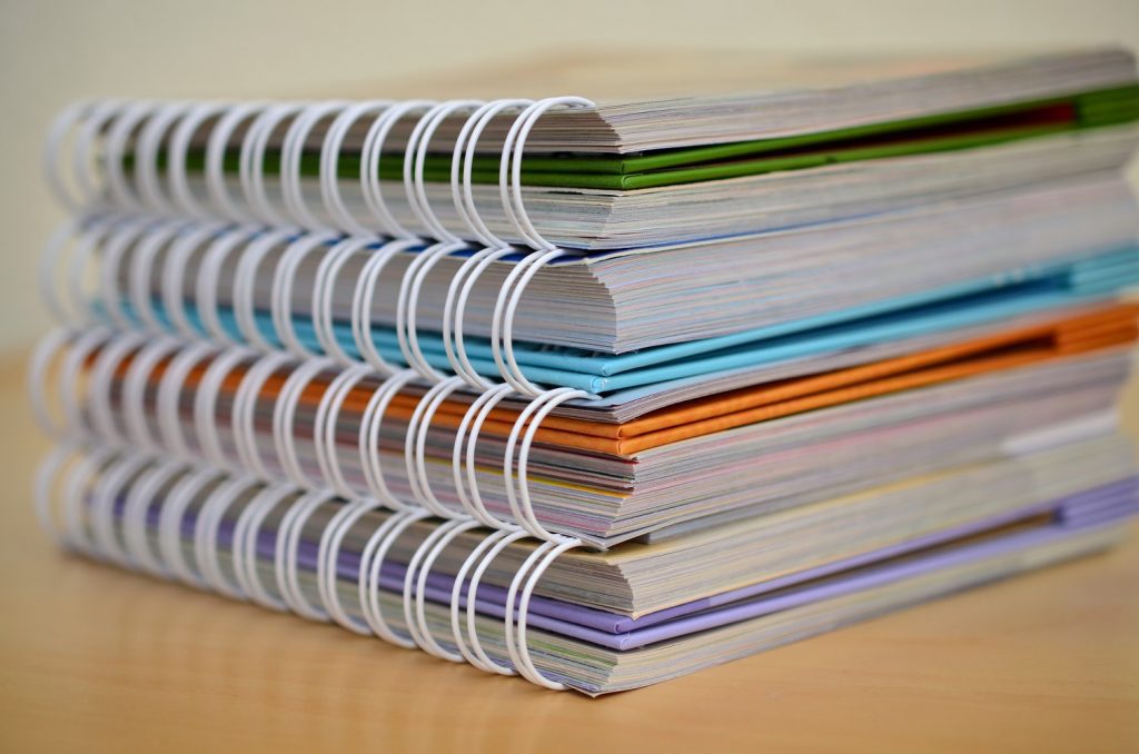 Stacked notebooks used for document management