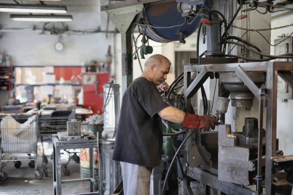 Man in an old factory with no digital tools